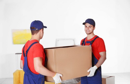 Packed boxes and furniture ready for a local removal van