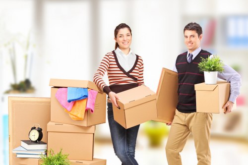 Packed moving boxes and furniture ready for transport