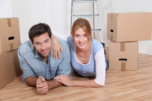 Professional movers handling furniture in a Crystal Palace property