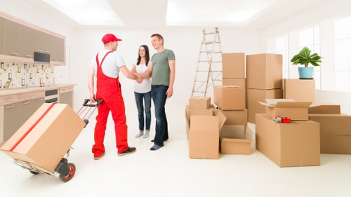 Team coordinating a careful furniture move indoors